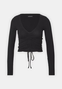 Schwarzes, geripptes, langärmeliges Crop-Top mit tiefem V-Ausschnitt und verstellbarem Kordelzug am Saum. Verfügt über Raffung im Frontbereich.