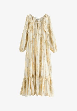 Duga krema haljina s zlatnim cvjetnim uzorcima, volanastim dekolteom i rukavima. Ima slojeviti donji dio s suptilnom teksturom. Ležeran dizajn.