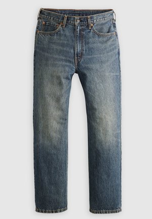 Jeans in denim blu con gamba dritta e finitura sbiadita, cinque tasche, rivetti in rame e cuciture a contrasto, progettati per una vestibilità comoda.