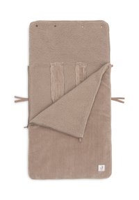 Tapis pliable de couleur beige clair, avec un tissu doux et texturé, doté d'un côté semblable à du Sherpa et d'une texture nervurée. Maintenu par des liens et des pressions.
