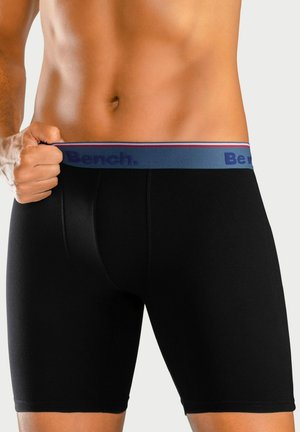 Black boxer briefs with a gray waistband featuring red and blue stripes and the "Bench." logo. Smooth fabric with a fitted design.