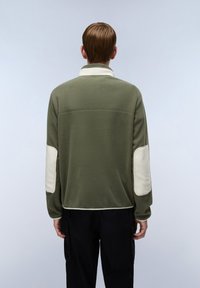 Olive green fleece jacket with a white collar, featuring white elbow patches and a relaxed fit, shown from the back.