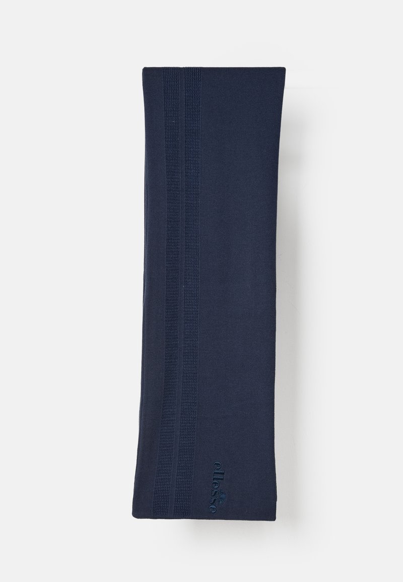 Mørkeblå tørklæde med ribbet struktur og tre lodrette striber. Har et diskret logo i det nedre hjørne. Blød, forlænget design.