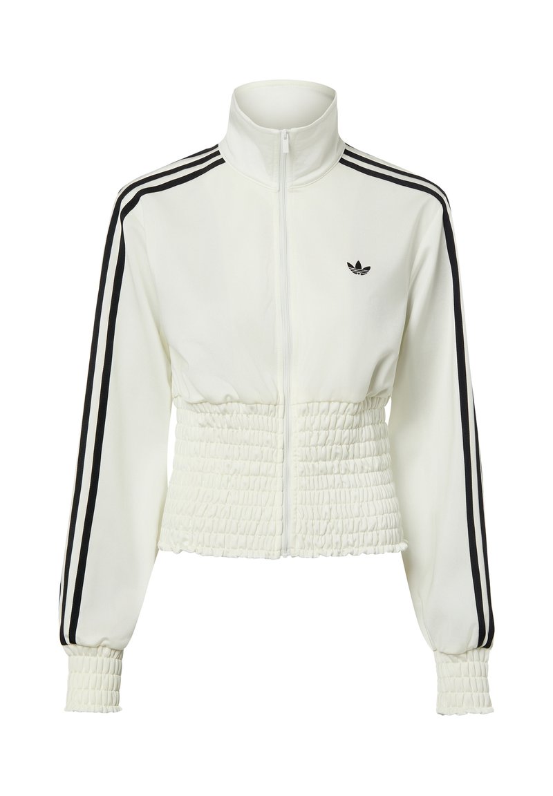 Weißes Adidas-Trainingsjacke mit Reißverschluss, schwarzen Streifen an den Ärmeln, geraffter Taille und Bündchen sowie dem Adidas-Trefoil-Logo auf der Brust.