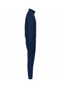 Tuta navy con giacca con zip e polsini elasticizzati, dotata di un colletto alto e pantaloni a sigaretta. Tessuto liscio e resistente; design minimalista.
