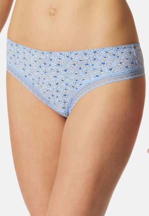 Woman wearing light blue floral patterned hipster underwear with lace trim on thighs and waistband.