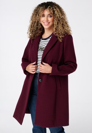 Manteau en mélange de laine bordeaux avec un col cranté, fermeture à un bouton et poches latérales. Tissu texturé et chaud avec une coupe décontractée.