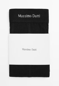 Black socks with a textured band and white "Massimo Dutti" logo. Packaged with a simple white label displaying the brand name.