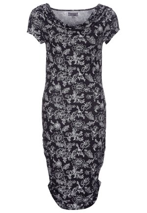 Robe noire longueur genou avec motif floral blanc, manches courtes et encolure drapée.