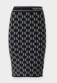 Jupe crayon en tricot noir avec un motif répété du logo gris "KL" et une taille noire portant le nom de la marque "KARL LAGERFELD."