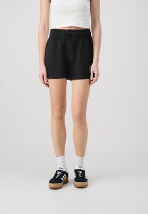 GAP HERITAGE - Spodnji deli trenirk - true black