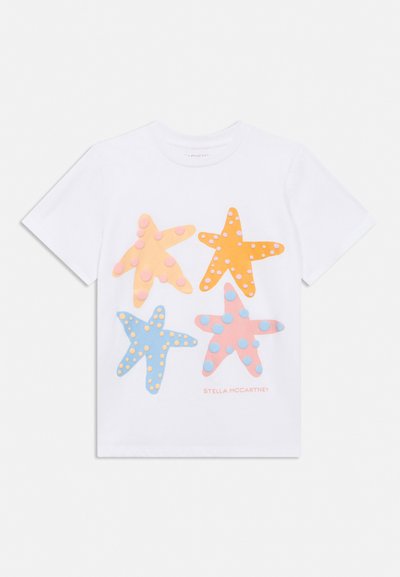 White short-sleeve T-shirt with four colorful starfish shapes featuring raised dots, and "Stella McCartney" text in light pink below.