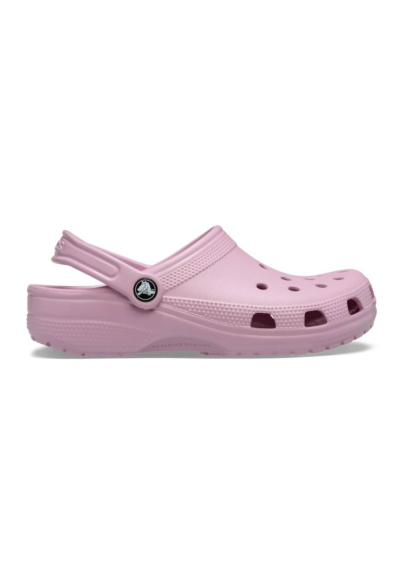Pink Croslite clogs with vented design, rounded toe, and back strap. Surface is smooth with a textured base and logo accent.