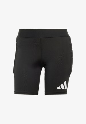 Czarne sportowe spodenki wykonane z rozciągliwego materiału, z szerokim paskiem w talii, wyściełanymi bokami oraz białym logo Adidas na lewej udzie.