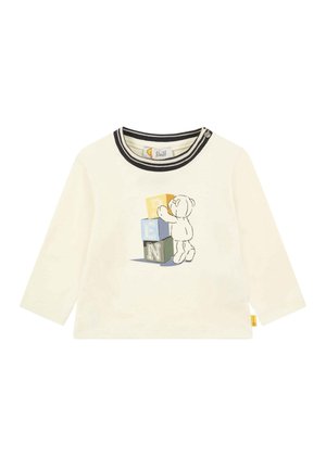 Cremefarvet langærmet babytrøje med sortstribet krave og en bamse, der stabler farverige klodser, der staver "PEN" på forsiden.