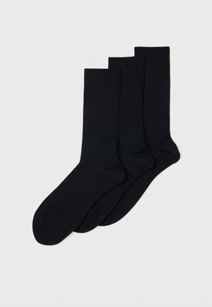 Black ribbed socks in a pack of three, featuring a smooth texture, medium height, and reinforced toe and heel details.