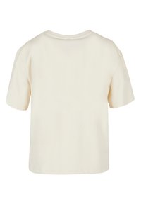 Cream-colored cotton t-shirt with short sleeves, a round neckline, and a relaxed fit. Smooth texture with no visible patterns or embellishments.
