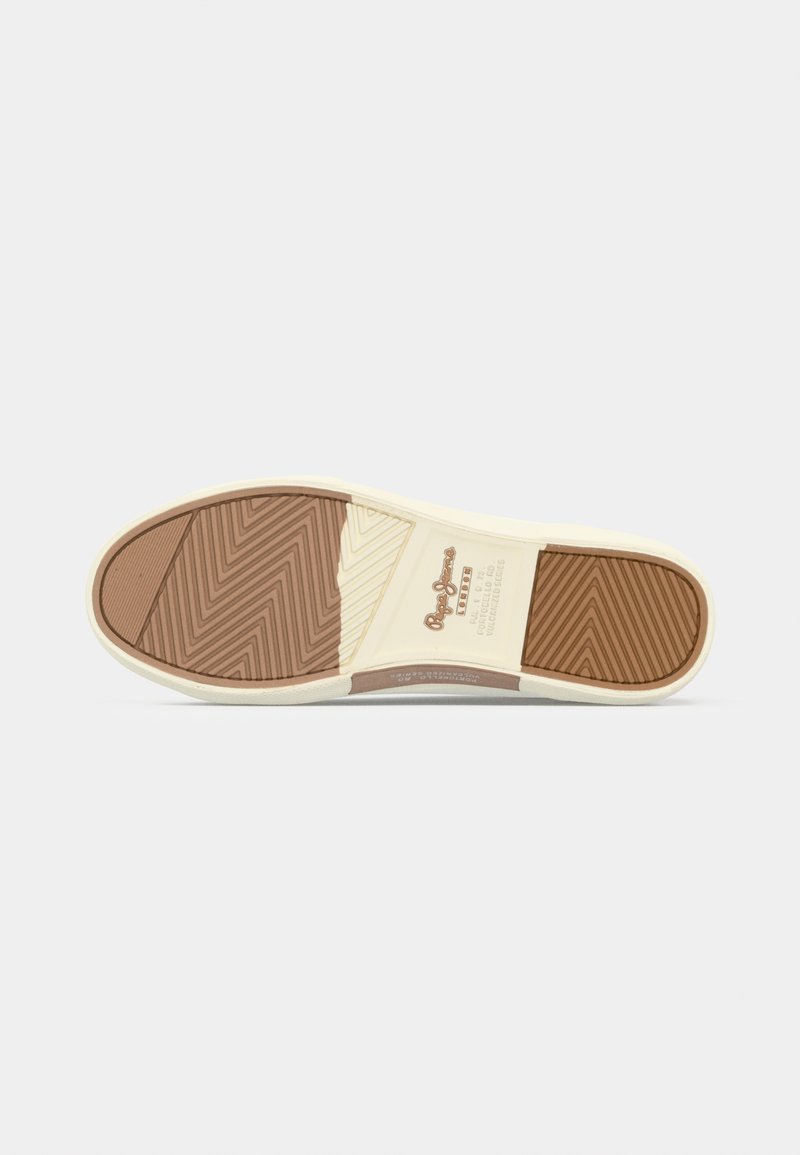 Suela de zapato con secciones de goma marrón y beige, con agarres texturizados en zigzag, y detalles de la marca y tamaño grabados en el centro.