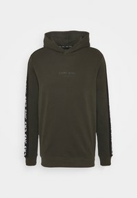 Olive green hoodie with a front kangaroo pocket, black sleeve accents, and white "CARS JEANS" text along the sleeves. Soft fabric texture.