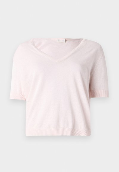 Vaaleanpunainen, lyhythihainen V-pääntiellä varustettu neule, jossa on pehmeä tekstuuri ja ribbausreunat. Ominaisuuksiin kuuluu rento, lyhyt malli.