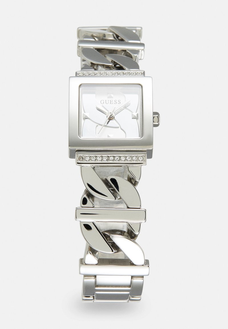 Montre-bracelet Guess ton argent avec un cadran carré, des accents en cristal au-dessus et au-dessous du cadran, et un bracelet à maillons épais.