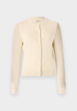 Krämfärgad cardigan med rund halsringning, knäppning och stjärnmönster på framsidan. Tillverkad av mjukt stickat tyg med ribbade ärmslut.