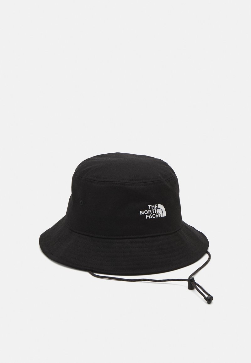 Black bucket hat made of cotton with a flat crown and wide, downward-sloping brim. Features a white logo on the side and an adjustable chin strap.