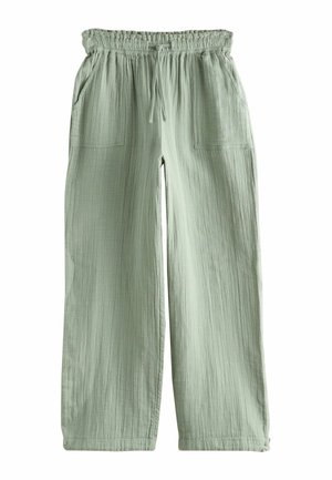 Light green loose-fit pants with an elastic waistband and drawstring, featuring front patch pockets and a textured fabric.