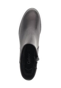 Black ankle boot made of smooth leather with a rounded toe. Features a side zipper and soft interior lining. Logo visible inside.