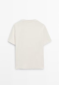 T-shirt a maniche corte in cotone avorio, con colletto a giro e orlo dritto, dalla texture liscia e senza grafiche visibili.