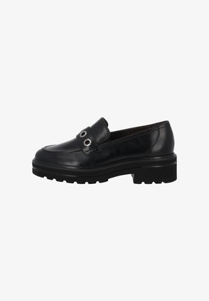 Zwarte leren loafers met een ronde neus, rubberen zool en decoratieve metalen oogjes op een band. Subtiele stiksels aan de zijkant.
