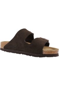 Sandale à glissière en daim marron avec deux larges brides et découpes, semelle en liège et semelle en caoutchouc texturé ; arbore un logo Birkenstock.