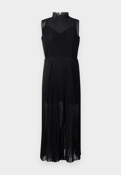 Must mustriga kleit kõrge kaelusega ja ilma varrukateta. Kangas paistab ülemises osas kerge ja läbipaistev, alumises osas voogav.