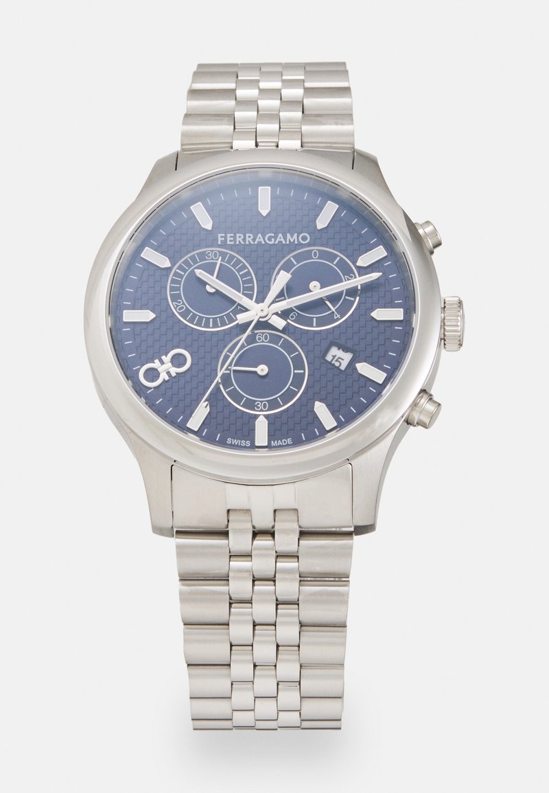 Silver stainless steel watch with a textured blue dial, three sub-dials, silver hour markers, and a date display. Features a metal link bracelet.