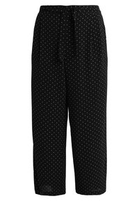 Pantalon noir léger à pois blancs. Il présente une coupe décontractée, une taille avec liens ceinturés, et une longueur raccourcie avec des jambes légèrement effilées.