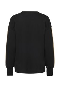Schwarzer Hoodie mit langen Ärmeln, lockerer Passform und beigen Akzentpaneelen an den Schultern. Weicher Stoff mit gerippten Bündchen und Saum.