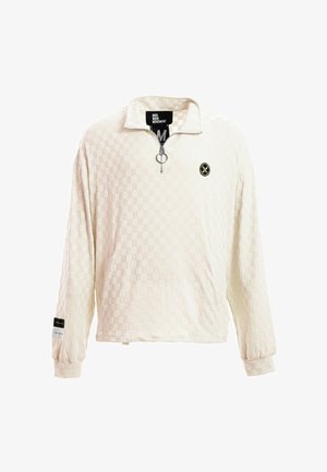 Jersey de manga larga de textura cremosa con cremallera hasta un cuarto y tirador en forma de anilla, puños acanalados, pequeño logo redondo en el pecho y etiqueta en la manga izquierda.