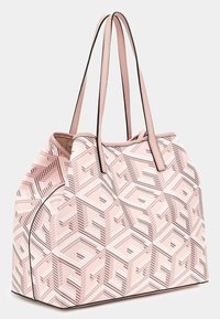 Růžová taška s geometrickými vzory, hladkým povrchem, dvojitými uchy a černým lemováním. Prostorný design pro každodenní použití.