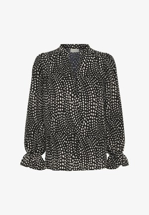 Črna bluza z belo nepravilnimi pikami, dolgimi napihnjenimi rokavi z robovi z nagubanim volanom in okroglim izrezom z rahlo V-rezo.