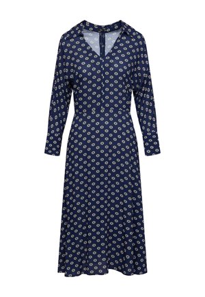 Námořnické šaty s dlouhými rukávy, výstřihem do V a detailem s knoflíky. Mají květinový vzor v bílé a zelené barvě po celém povrchu. Rozšířená sukně.