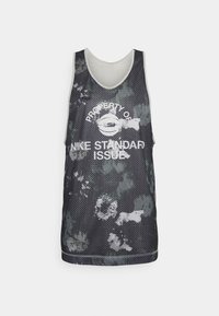 Black and gray mesh tank top featuring a camouflage pattern, round neckline, and white graphic text stating "PROPERTY OF NIKE STANDARD ISSUE."