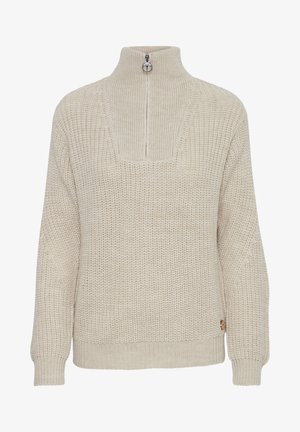 Bežs adīts džemperis ar augstu apkakli, pusotru rāvējslēdzēju, brīvu piegriezumu, ribotām piedurknēm un kvadrātveida dekoltē detaļu. Iespējams neliels logotipa akcents.