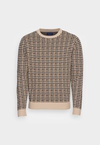 Beżowy sweter w wzór houndstooth w czerni i brązie. Okrągły dekolt, ściągacze przy mankietach i u dołu, teksturowana dzianina.