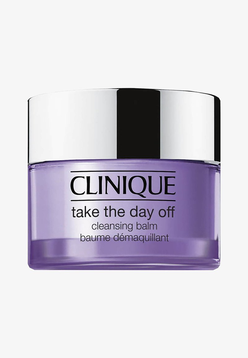 Bálsamo limpiador morado en un tarro de vidrio claro con una tapa plateada. La etiqueta presenta texto negro: "Clinique take the day off cleansing balm."
