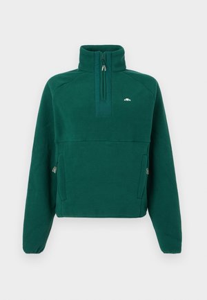 Tumeroheline fliisist pullover kõrge krae ja pool lukuga. Omab küljetaskuid ja tekstureeritud kangast sooja hoidmiseks. Väike logo rinnal.