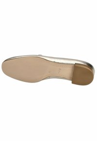Metallic gold flat shoe sole with a smooth surface, rounded toe, and a low rubber heel. Features textured grip pattern on the sole.