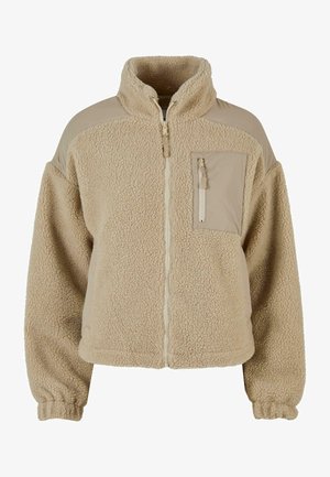 Beige Fleecejacke mit hohem Kragen und Reißverschluss vorne. Verfügt über eine Brusttasche und kontrastierende Schultereinsätze. Strukturiert, gemütlicher Stoff.