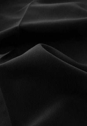 Black fabric with a smooth texture, exhibiting soft folds and subtle sheen; even surface with no visible patterns or accents.