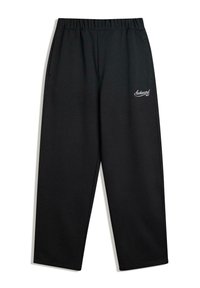 Sort, løstsiddende sweatpants med elastisk talje, sidelommer og lille hvid logoaccent på venstre lår. Tekstureret stof.