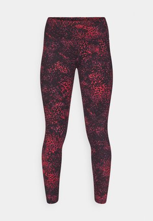 Høyt midjede leggings i svart med et rødt abstrakt mønster. Laget av et elastisk, lett stoff, med en glatt tekstur og tettsittende fasong.
